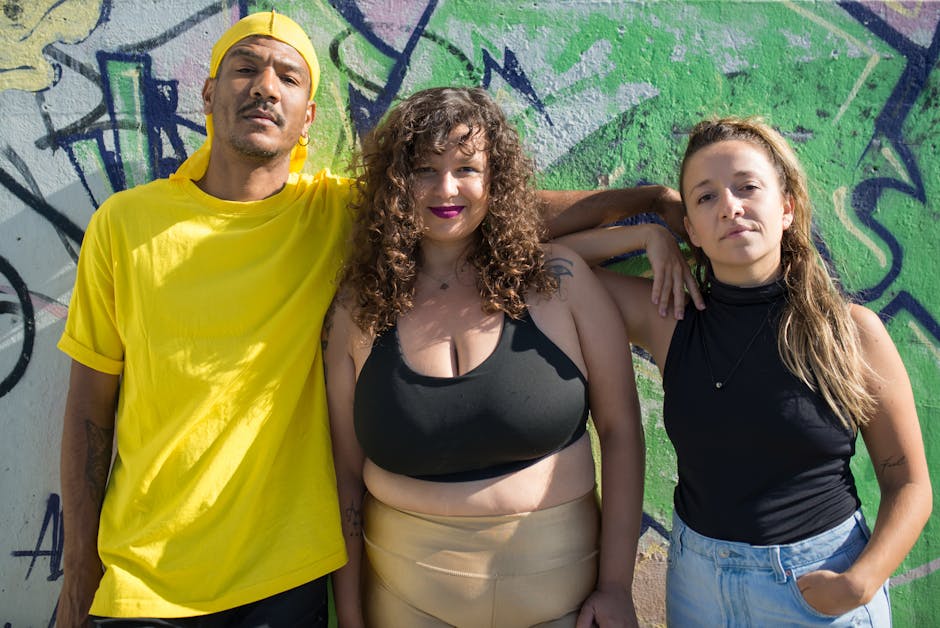 A diverse group of smiling people in comfortable clothes looking relaxed
