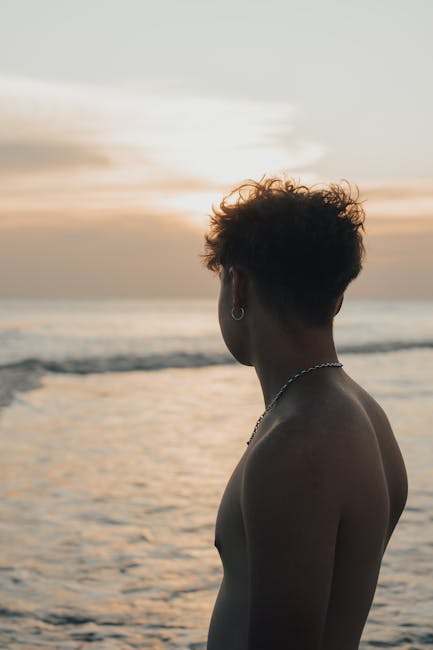 Silhouette of a person doing a gentle morning stretch against a sunrise backdrop